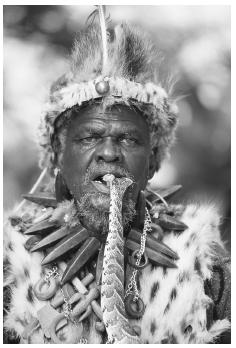 In the village of Eshowe in the KwaZulu-Natal Province in South Africa, a Zulu Isangoma (diviner), with a puff adder in his mouth, practices soothsaying, or predicting, with snakes. It is impossible to generalize about concepts in African religions because they are ethno-religions, being determined by each ethnic group in the continent. GALLO IMAGES/CORBIS