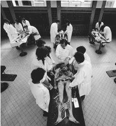 The dissection of human cadavers in medical school imparts not only the lessons of gross anatomy, but lessons on dealing with death. YANN ARTHUS-BERTRAND/CORBIS